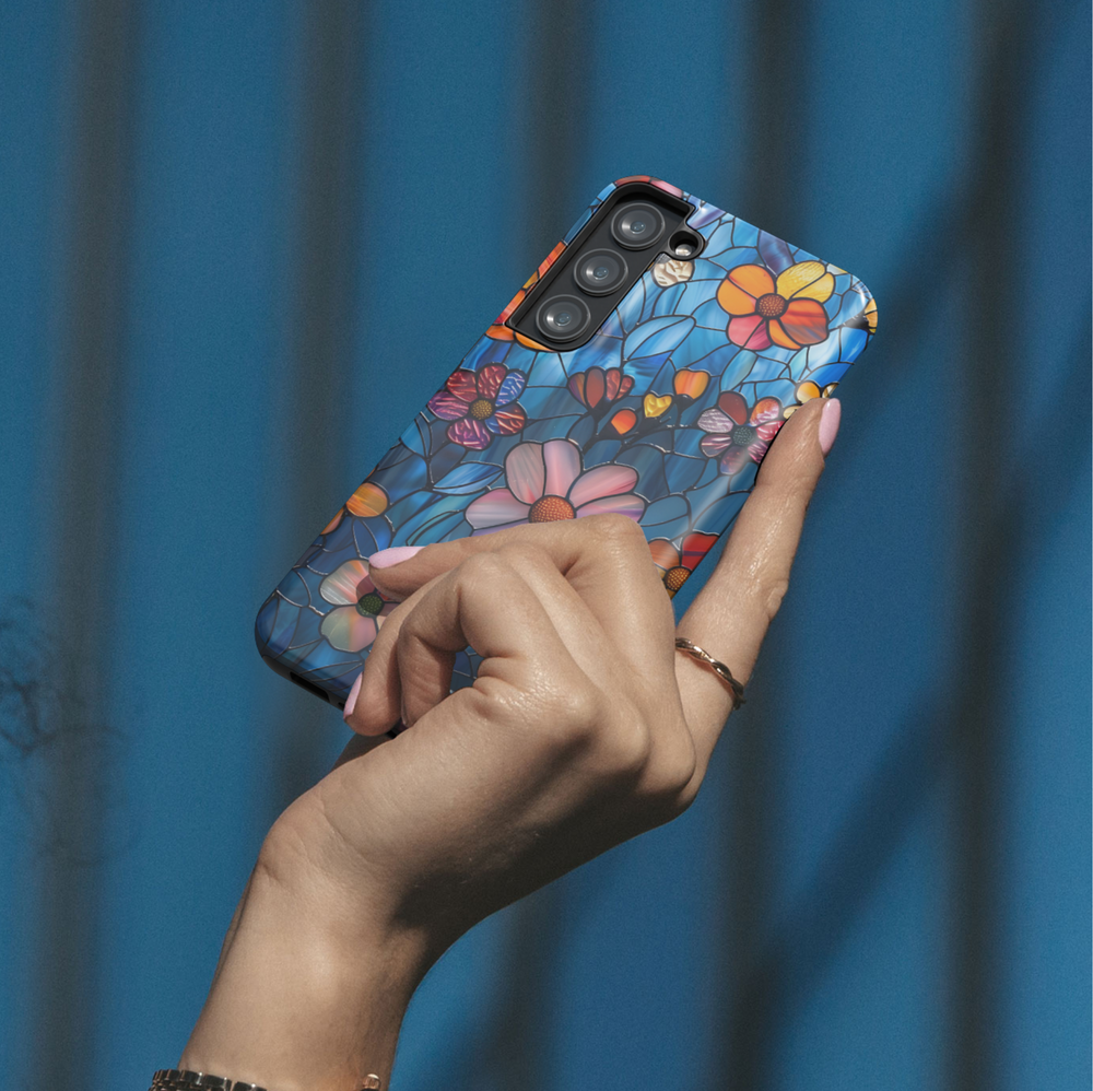Stained glass floral phone case with dark blue background and pink orange flowers