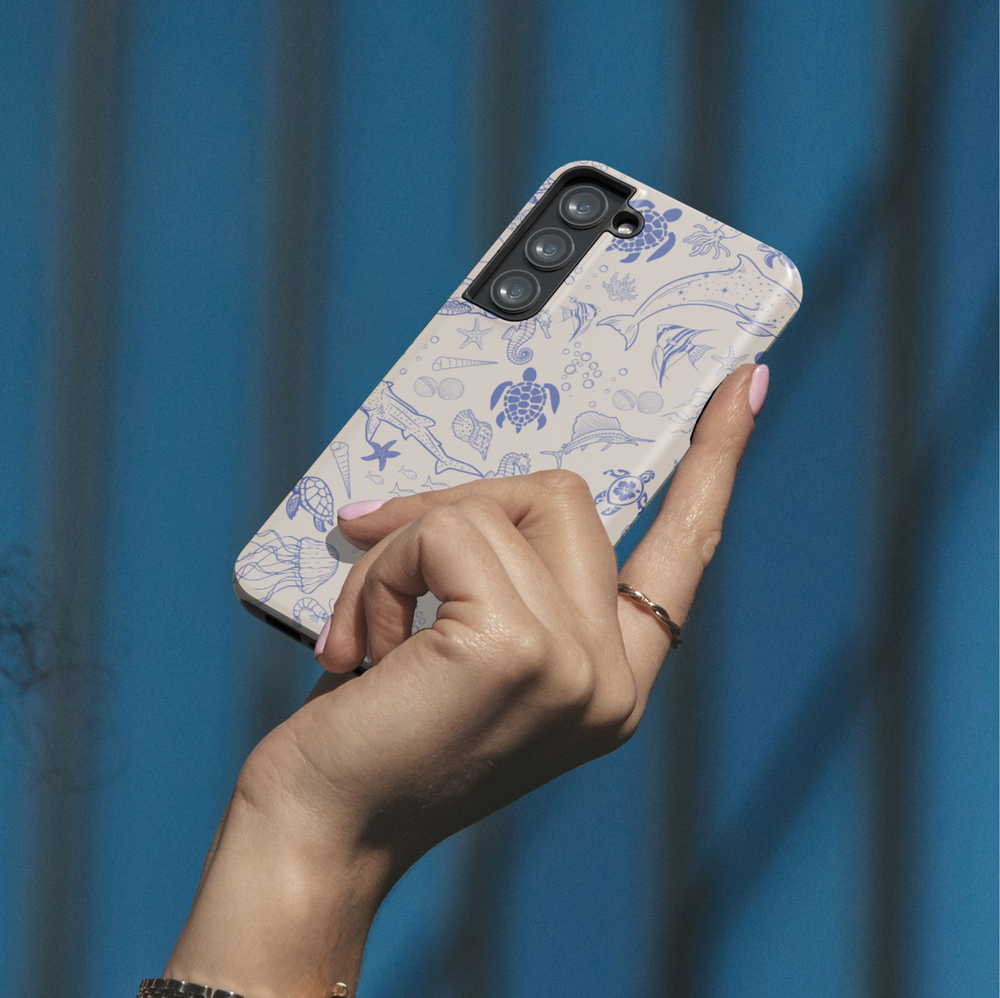 Samsung Galaxy phone case with blue ocean animal sketches on beige background – fits Galaxy S24 Ultra, S24 Plus, and S23 FE. Coastal sea life design for beach lovers