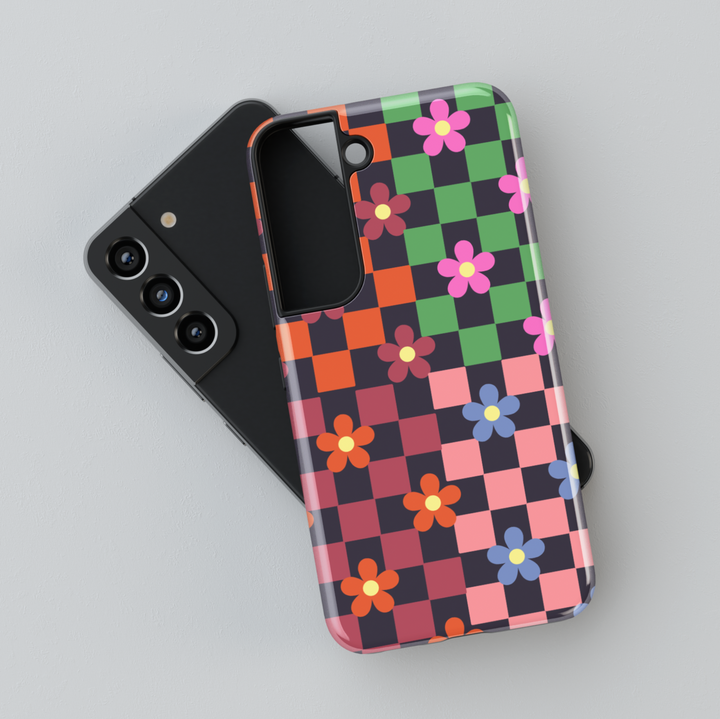 Samsung Galaxy case with retro checkerboard pattern and colorful flower designs. Compatible with Galaxy S24 Ultra, S24 Plus, and S23 FE. Bright and playful aesthetic.