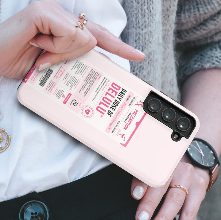Funny pink Samsung Galaxy case featuring a Daily Dose of Delulu prescription label with humorous pharmacy-inspired design.
