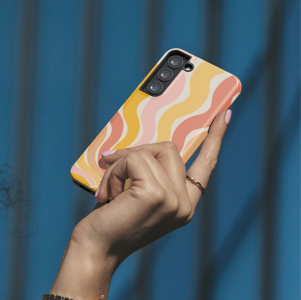 Retro Samsung Galaxy phone case with warm sunburst and wave pattern in orange, peach, and yellow – aesthetic summer design for Galaxy S24 Ultra, S25, S24 FE.