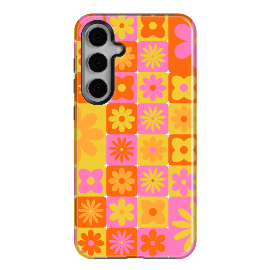 Samsung Galaxy case with retro 70s-inspired flower tile pattern in orange, pink, and yellow – fits Galaxy S24 Ultra, S25, and S24 FE. Bright vintage floral phone case for women.