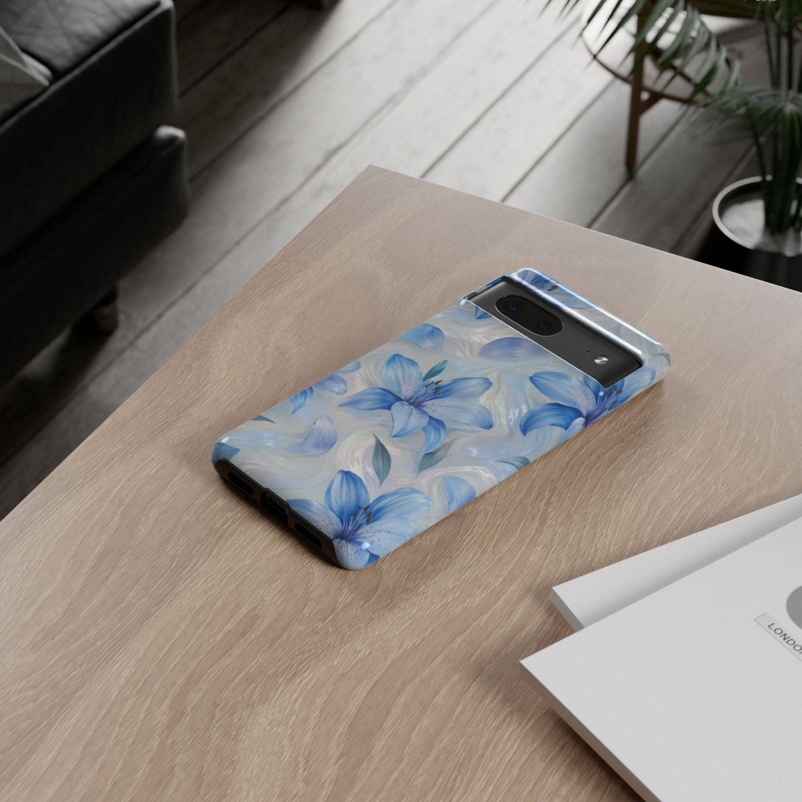 Google Pixel 10 Pro protective phone case featuring elegant blue lily flowers on a shimmering iridescent pearl background with premium dual-layer drop protection.