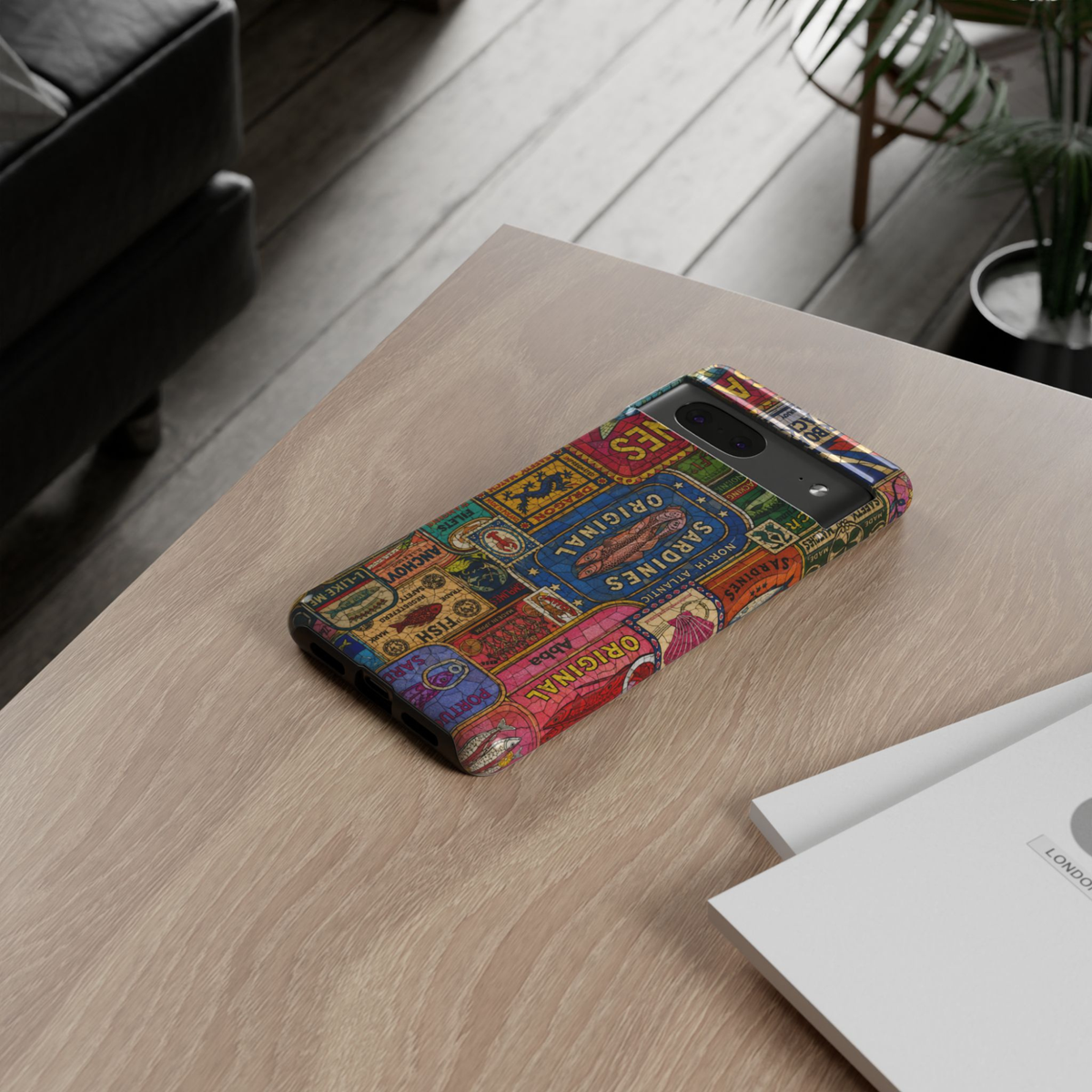 Protective Google Pixel 10 Pro phone case featuring a colorful collage of vintage sardine tins, retro seafood labels, fish market packaging, and classic European-inspired artwork with dual-layer protection.