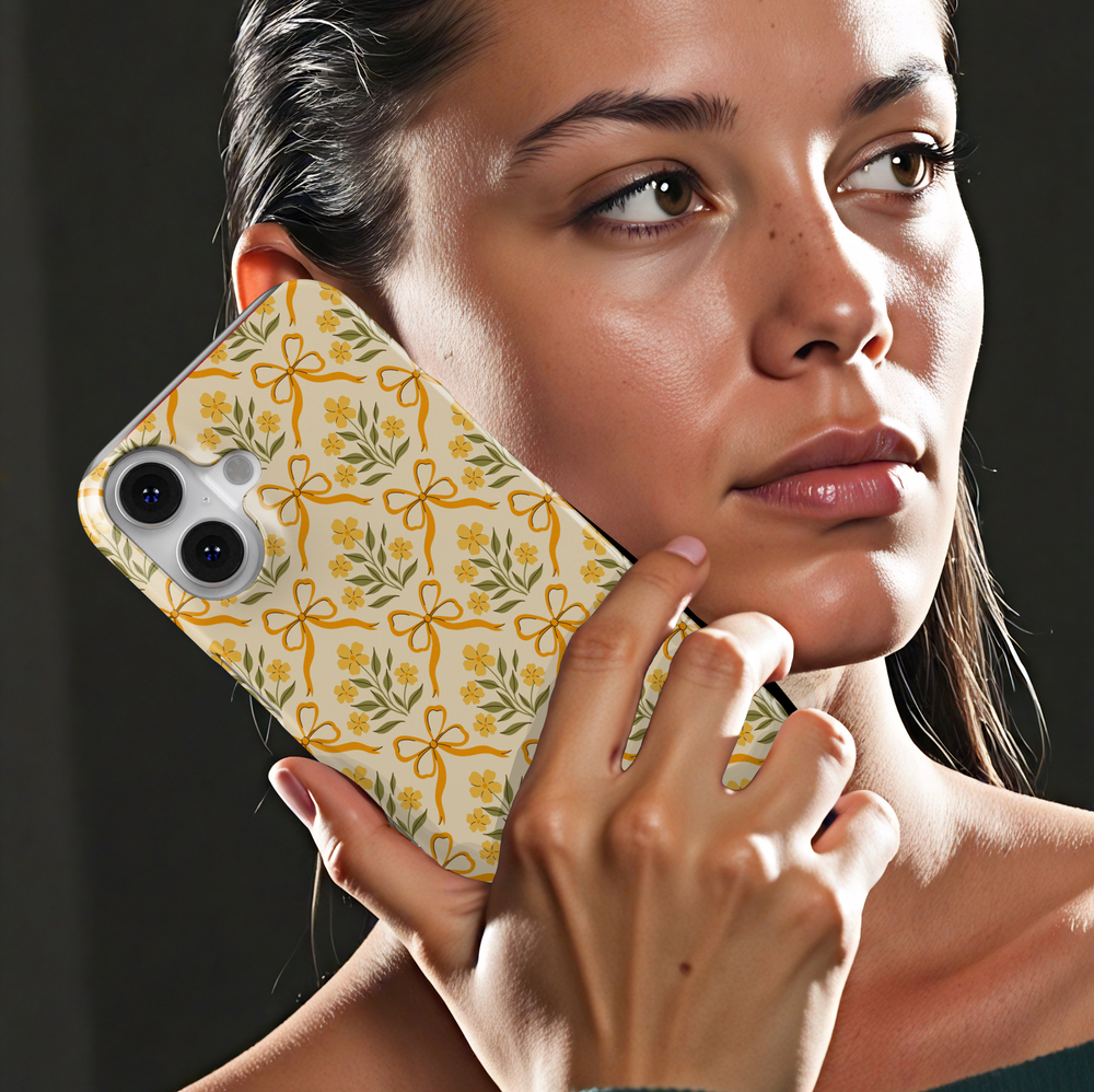 Yellow phone case with floral bow pattern, coquette vintage aesthetic design for iPhone and Samsung