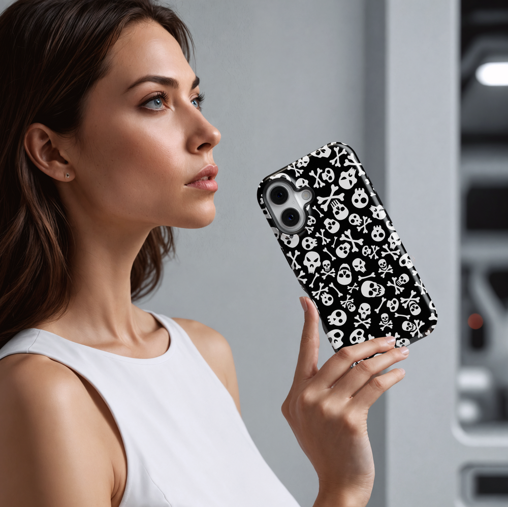Black iPhone case with white skull and crossbones pattern, Halloween skeleton aesthetic, spooky gothic phone cover, scary skull print for iPhone 16, 15, 14, 13.