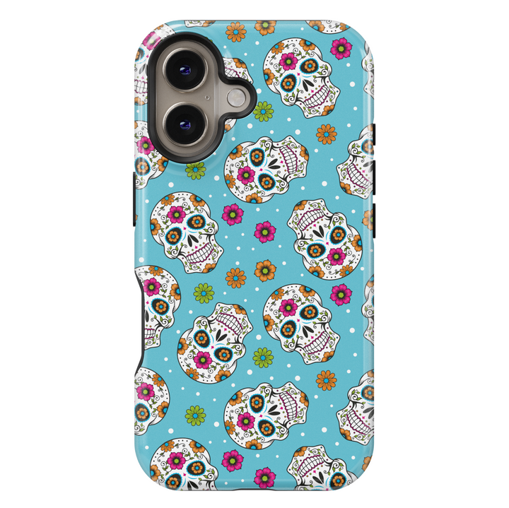 Bright sugar skull iPhone case with vibrant orange, pink, green, and blue floral patterns on a turquoise blue background. Features traditional Day of the Dead (Día de los Muertos) skull art for iPhone 16 Pro Max, 15, 14, and 13 models. Bold, festive, and eye-catching design perfect for Halloween and fall celebrations.

