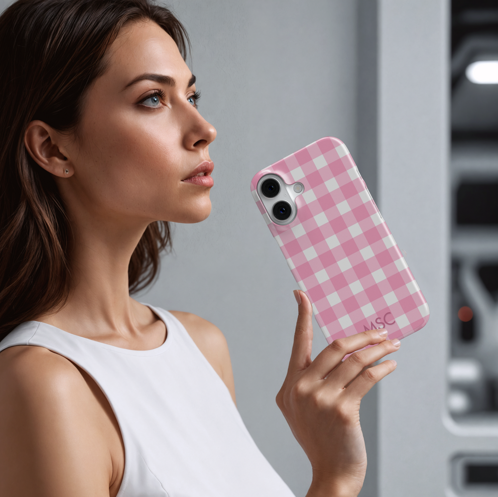 Personalized pink gingham iPhone case with custom initials. Cute checkered plaid phone cover in blush pink and white, designed for iPhone 15, iPhone 14, iPhone 13 Pro Max, and more. Aesthetic girly protective case with a trendy check pattern.