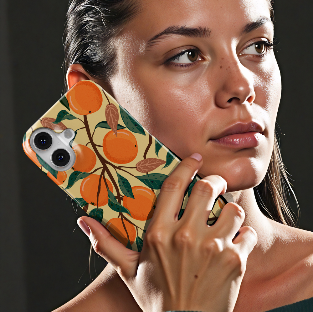 Orange fruit patterned iPhone case with leafy branch design on beige background. Summer aesthetic citrus phone cover for iPhone 15, iPhone 14, iPhone 13 Pro Max and more. Durable protective slim snap case.