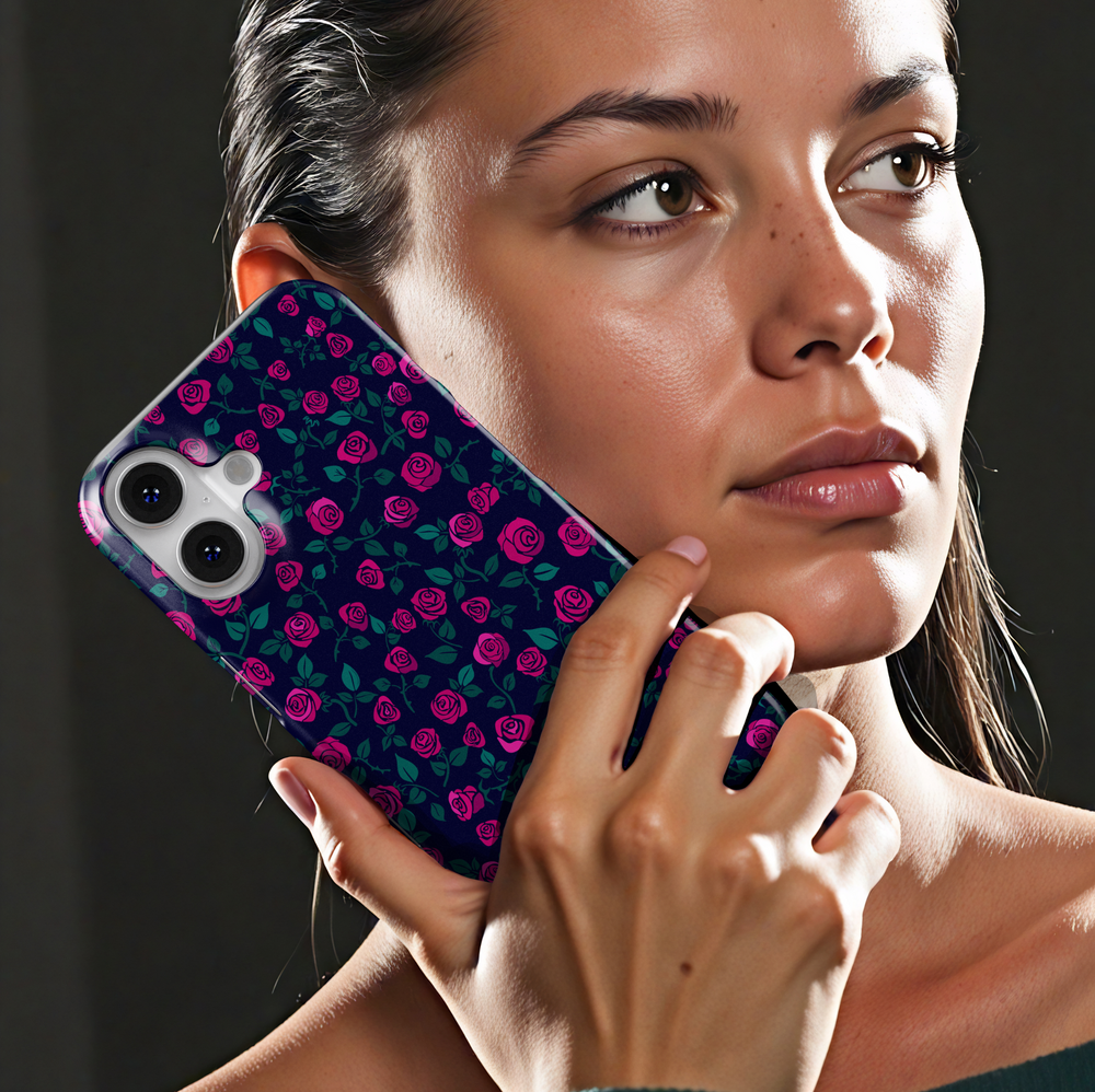 Pink rose floral iPhone case with navy blue background and green leaves. Romantic chic phone cover for iPhone 15, iPhone 14, iPhone 13 Pro Max and more. Protective slim snap case with elegant floral design.