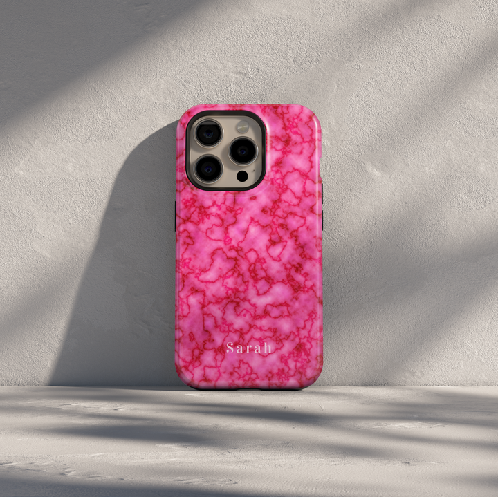Personalized pink marble iPhone case with custom name detail. Girly glossy finish, stylish protection, and a soft blush aesthetic. Compatible with multiple iPhone models.