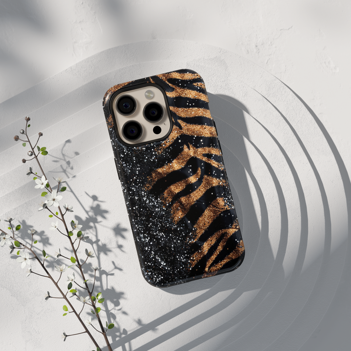 Black and gold leopard luxury phone case with glitter accents on a protective iPhone and Samsung Galaxy phone case for women