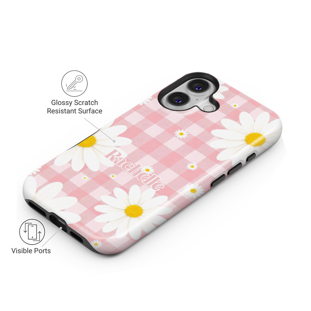 Custom name pink gingham iPhone case with white daisies. Cute floral aesthetic phone cover with a vintage picnic-inspired design.
