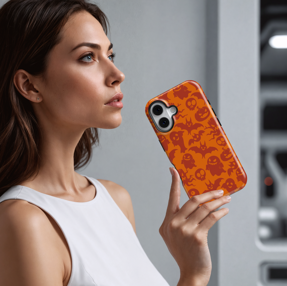 Orange Halloween iPhone case featuring a seamless pattern of spooky red ghosts, bats, pumpkins, skulls, and creepy eyes for a fun and festive look.