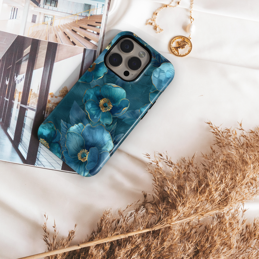 Teal blue floral iPhone tough case with gold-outlined petals and elegant botanical details