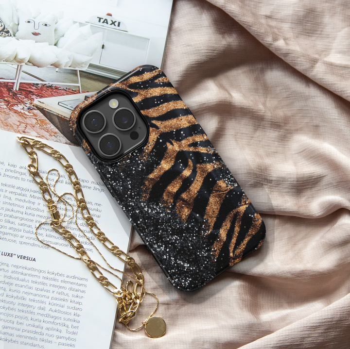 Black and gold leopard luxury phone case with glitter accents on a protective iPhone and Samsung Galaxy phone case for women