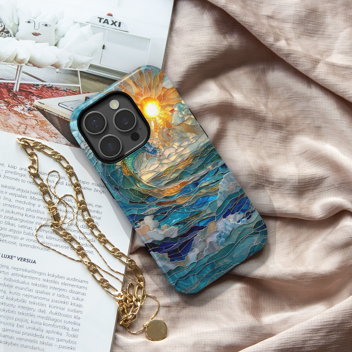 Ocean sunrise stained glass art phone case with blue waves and golden sun on a protective iPhone and Samsung Galaxy phone case