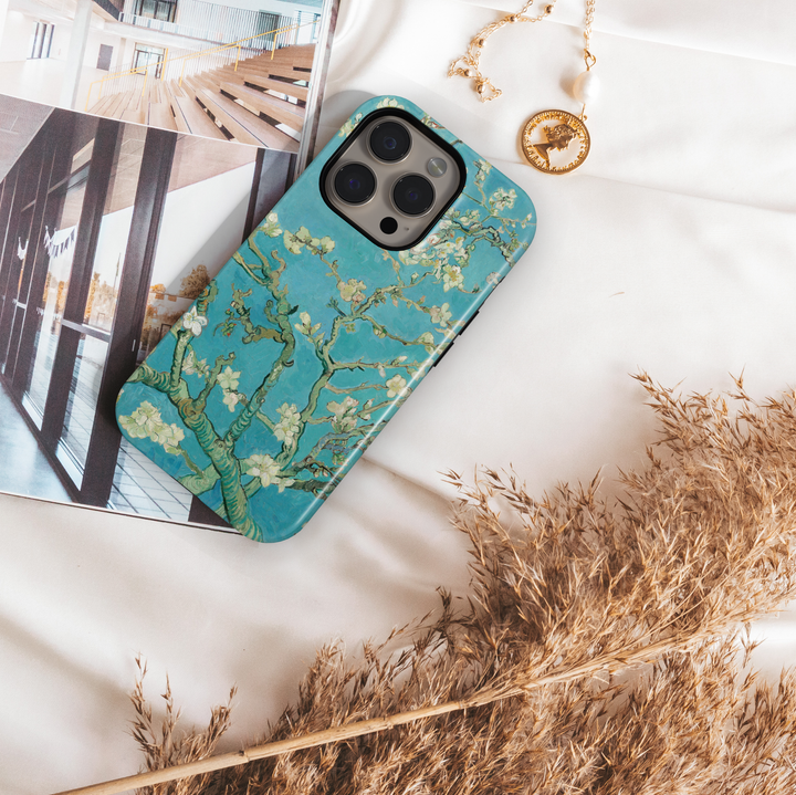 Blue almond blossom floral iPhone tough case with delicate white flowers and painterly botanical branches