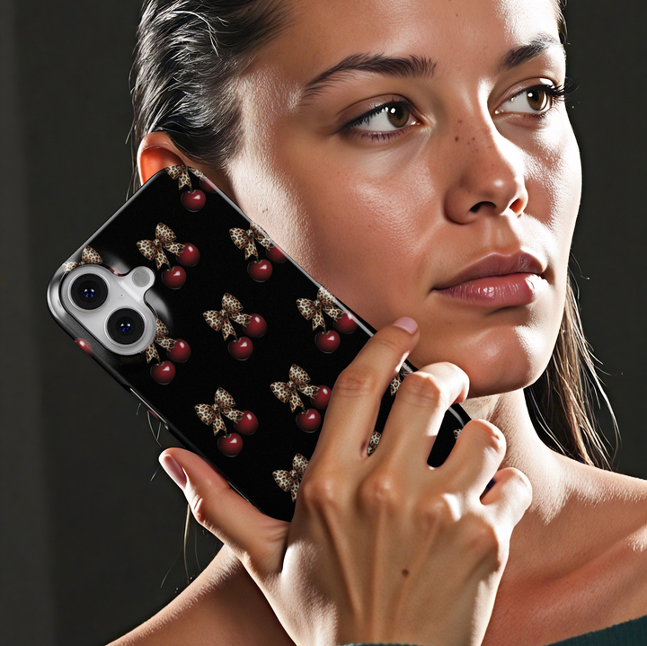 Black phone case with red cherry and leopard bow pattern, chic aesthetic animal print protective cover for iPhone and Samsung