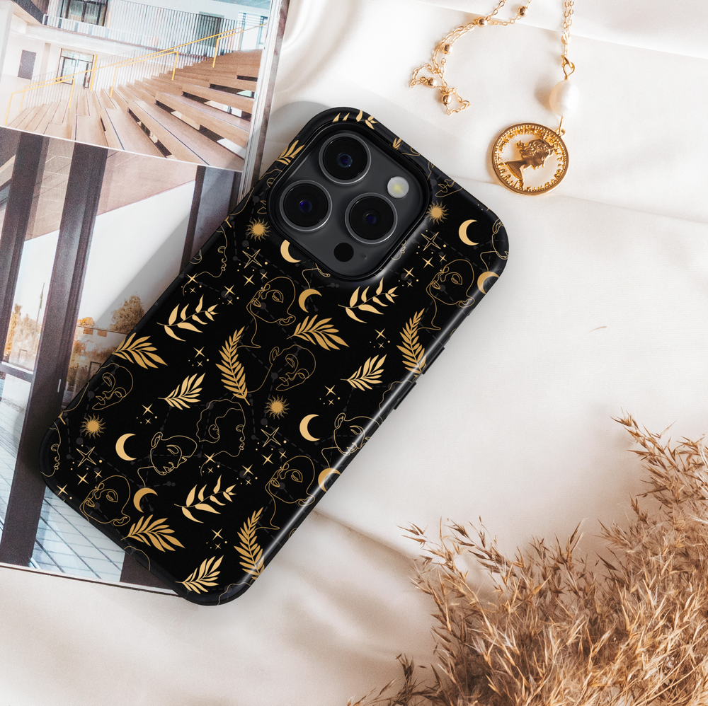 Black and gold celestial iPhone case featuring abstract face line art, crescent moons, suns, stars, and botanical leaves – modern boho astrology aesthetic, compatible with iPhone 16, iPhone 15 Pro Max, Galaxy S24 Ultra, and MagSafe.