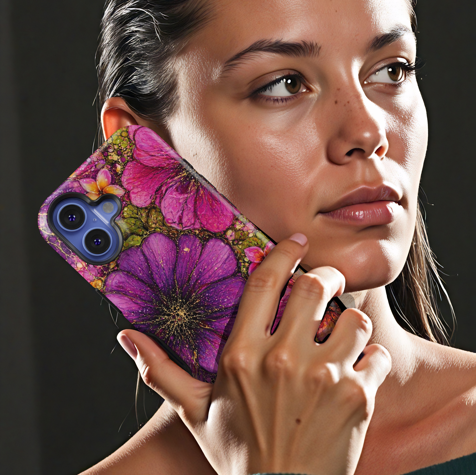 Purple and pink floral iPhone 17 Pro Max case with bold artistic flower design and gold speckled details.