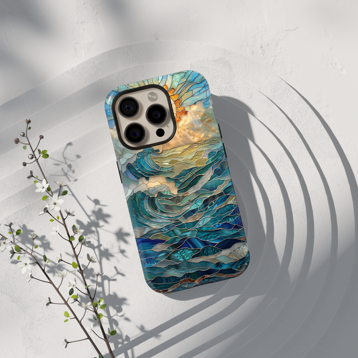 Ocean sunrise stained glass art phone case with blue waves and golden sun on a protective iPhone and Samsung Galaxy phone case