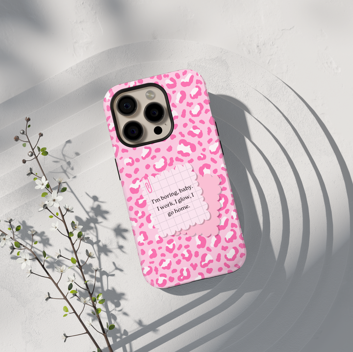 Pink leopard aesthetic phone case with bold lifestyle quote saying im boring baby i work i glow i go home on a protective iPhone and Samsung Galaxy phone case for women