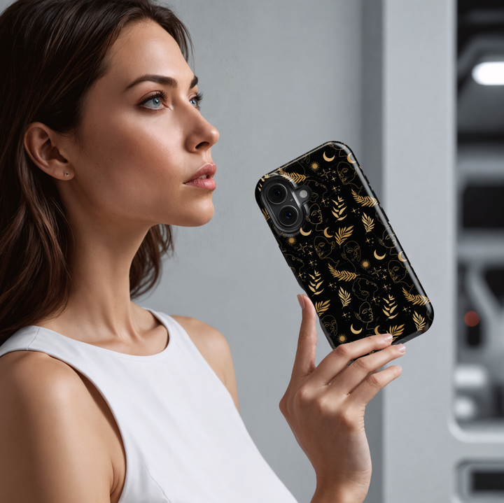 Black and gold celestial iPhone case featuring abstract face line art, crescent moons, suns, stars, and botanical leaves – modern boho astrology aesthetic, compatible with iPhone 16, iPhone 15 Pro Max, Galaxy S24 Ultra, and MagSafe.