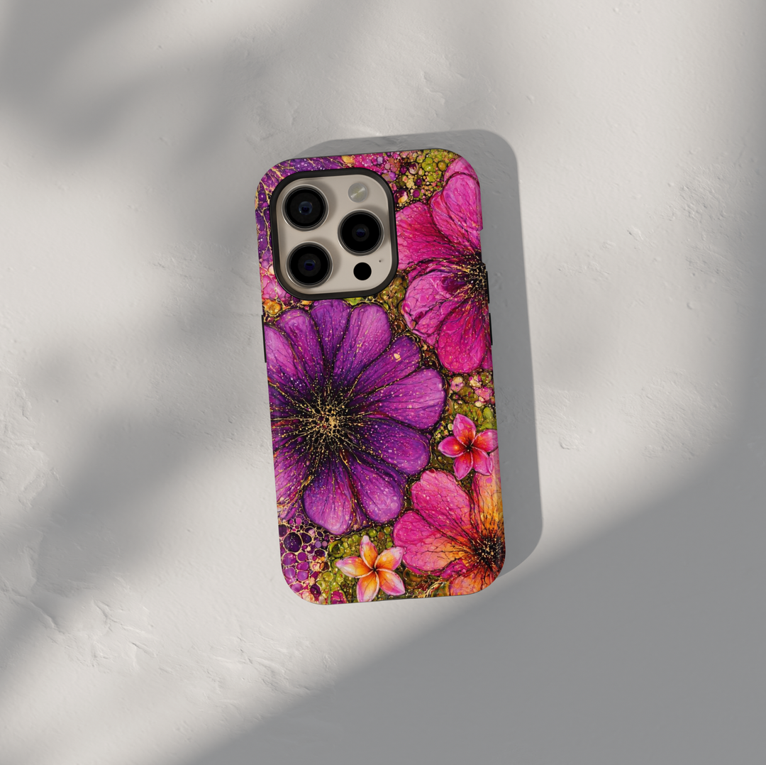 Purple and pink floral iPhone 17 Pro Max case with bold artistic flower design and gold speckled details.