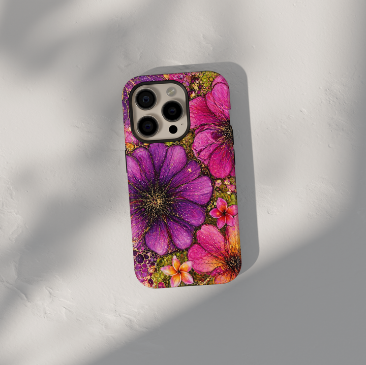Purple and pink floral iPhone 17 Pro Max case with bold artistic flower design and gold speckled details.