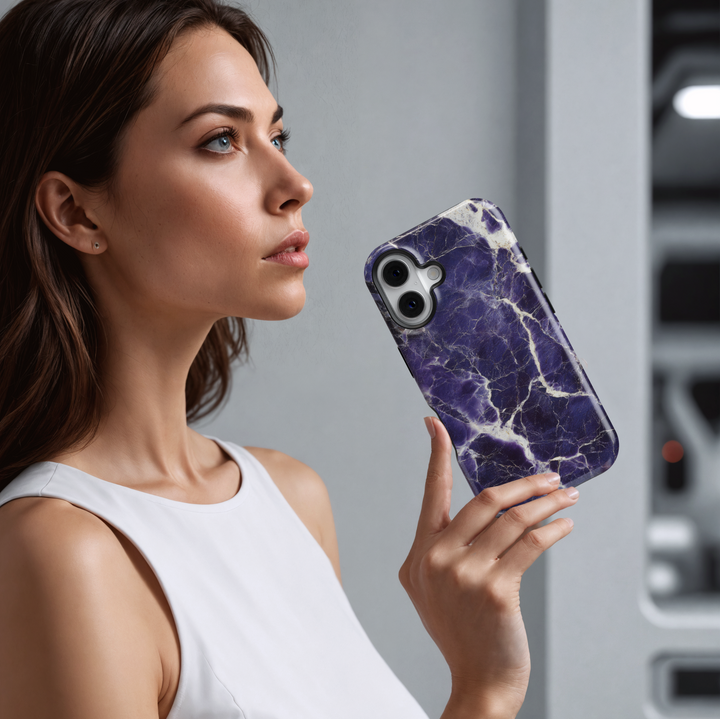 Dark purple marble iPhone 16 case with white cracked vein texture – premium gemstone-inspired design for iPhone models with MagSafe.