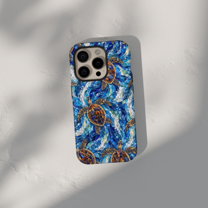 Sea turtle iPhone case featuring swimming turtles, blue ocean waves, stained glass inspired artwork, and vibrant coastal colors.