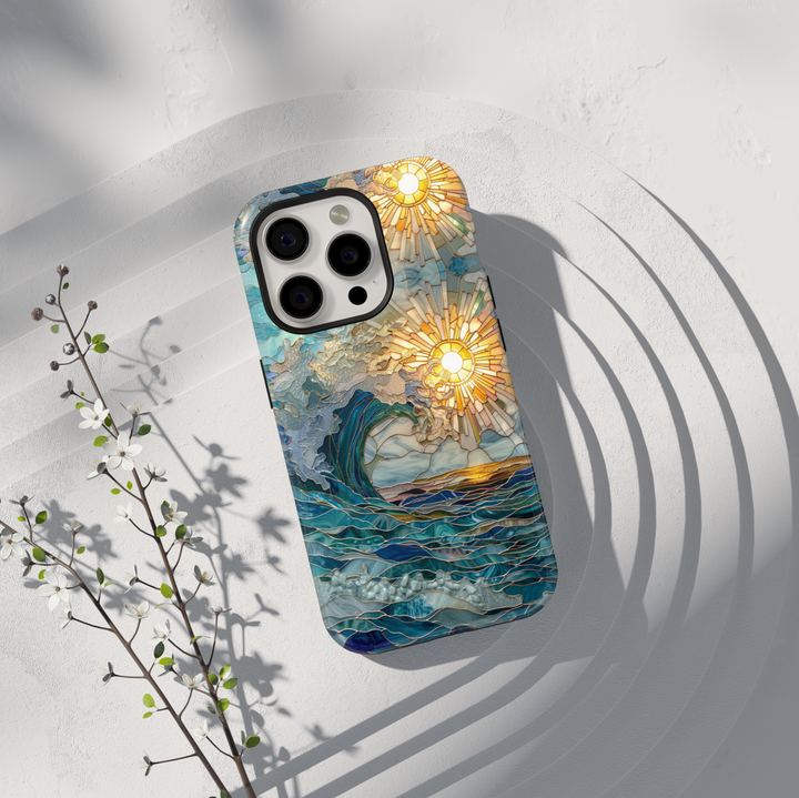Stained glass ocean wave phone case with golden sunburst and layered blue sea design on a tough protective case