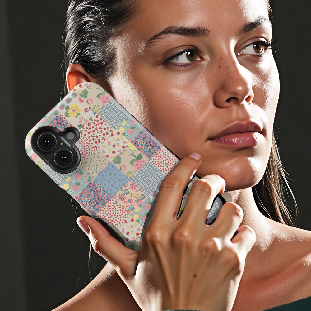 Pastel patchwork iPhone tough case with vintage floral tiles in pink, peach, green, and yellow
