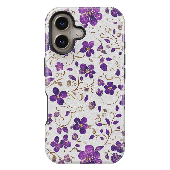 Purple floral iPhone case with shimmering gold accents and delicate vines on a light silver background. Elegant, girly, and perfect for a chic everyday look.