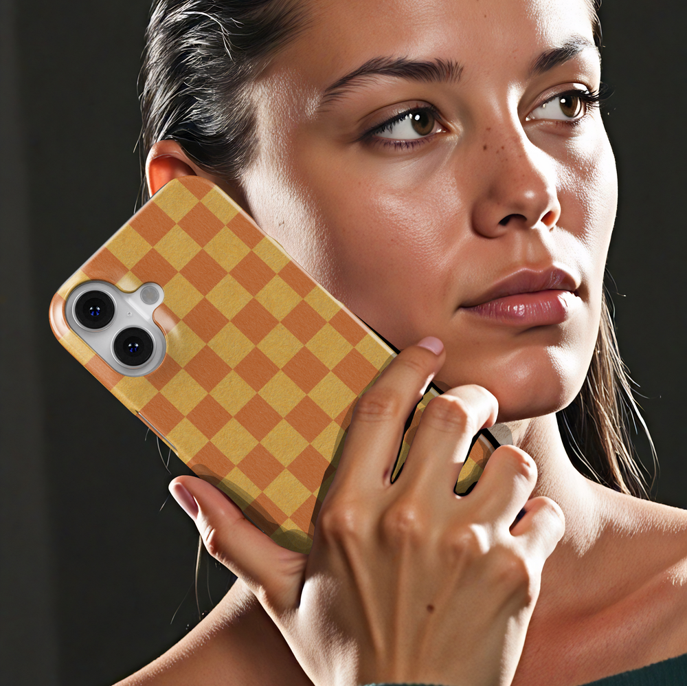 Orange and yellow checkerboard iPhone case, retro aesthetic grid phone cover, trendy warm-toned checkered protective iPhone 15, iPhone 14, iPhone 13 Pro Max case.