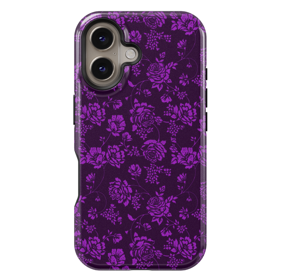 Elegant purple floral iPhone case with intricate rose and vine pattern on a deep violet background, perfect for a moody fall or Halloween aesthetic.