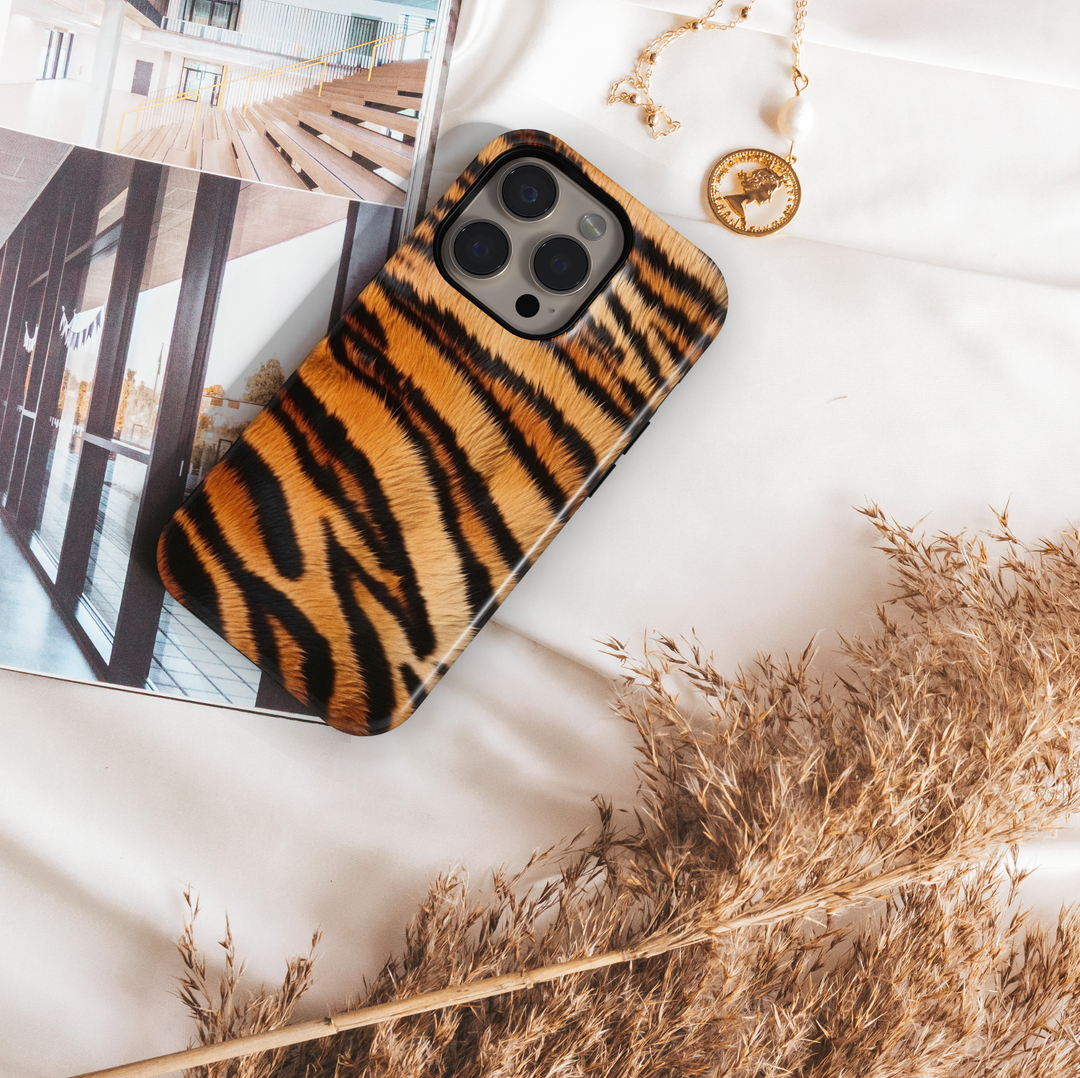 Tiger print phone case with orange and black stripes, wild animal pattern aesthetic cover for iPhone and Samsung, trendy protective phone case