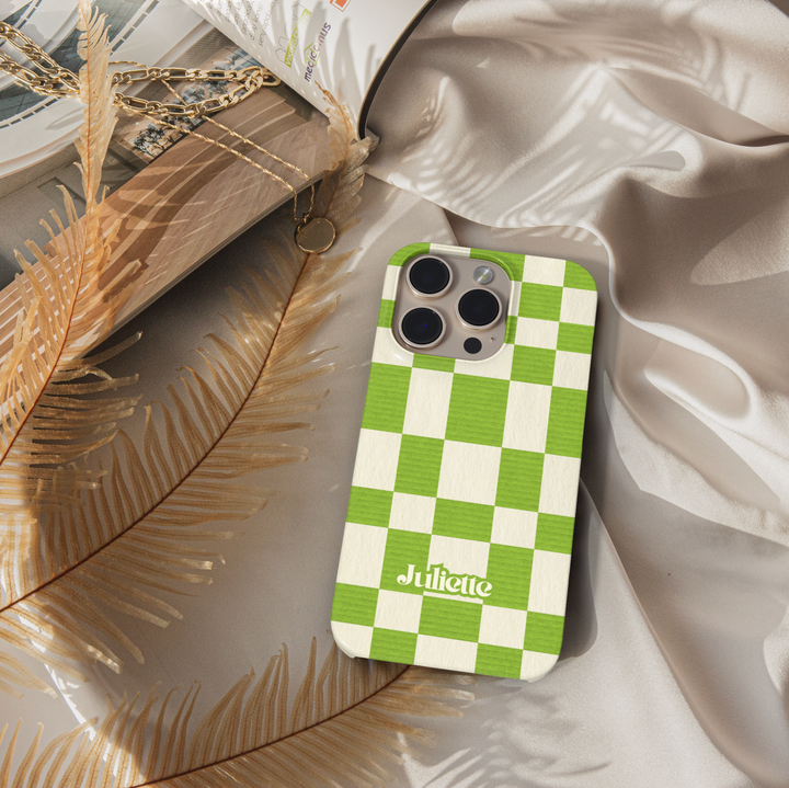 Green plaid iPhone case with oversized checkerboard design, trendy checkered phone cover in fresh green and cream, slim protective iPhone 15, iPhone 14, iPhone 13 Pro Max case. Modern aesthetic check pattern.