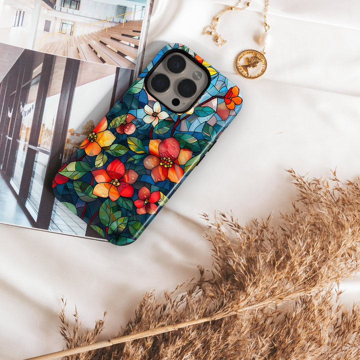 Colorful stained glass floral iPhone tough case with vibrant flowers and deep blue background