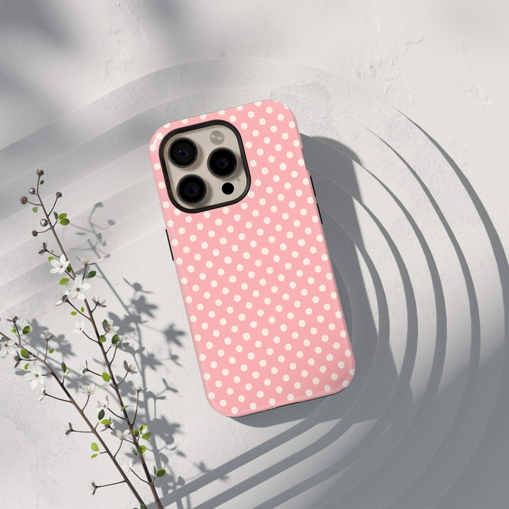 Pink polka dot personalized phone case with custom name on a protective iPhone and Samsung Galaxy phone case for women