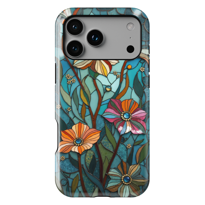 Teal stained glass iPhone case with floral patterns, leafy stems, and warm accent colors in an elegant artistic design
