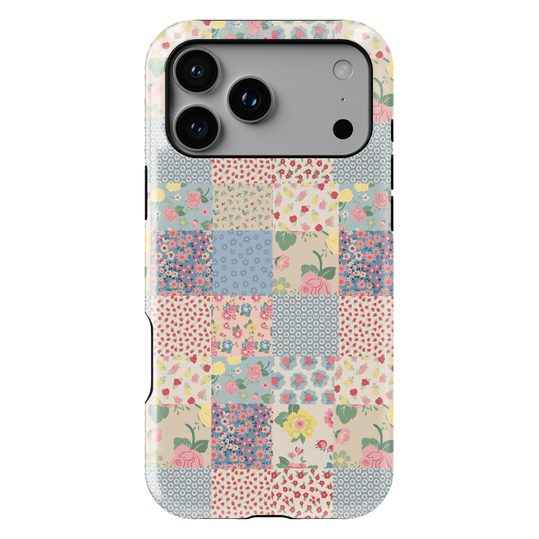 Pastel patchwork iPhone tough case with vintage floral tiles in pink, peach, green, and yellow