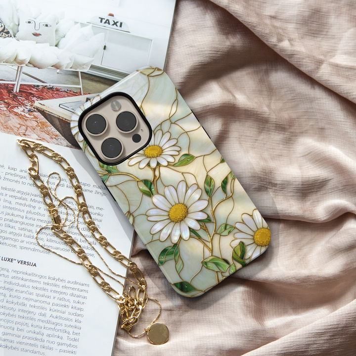 White daisy floral iPhone 17 Pro Max case with gold detailing and pearl background, aesthetic MagSafe tough case.