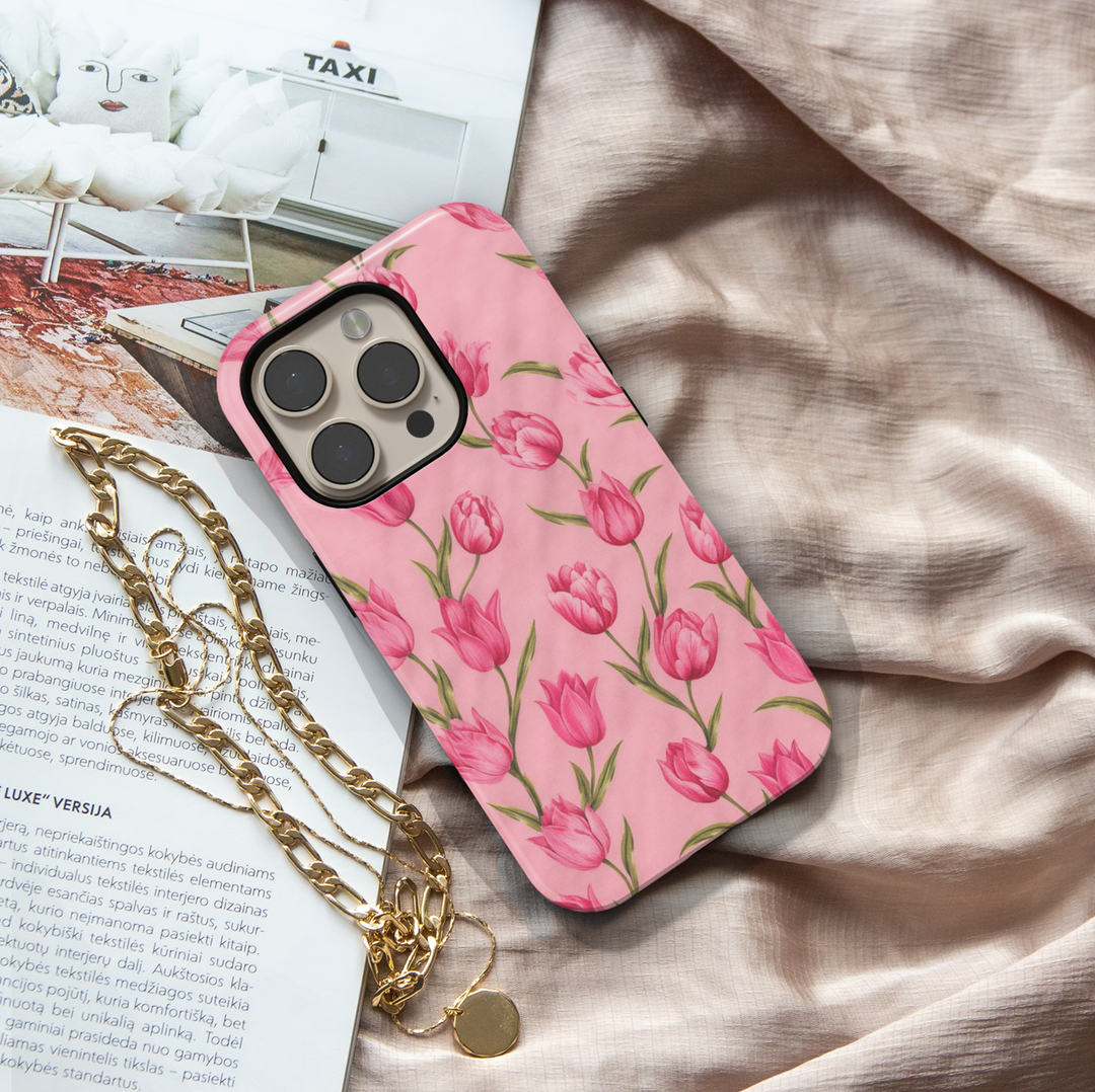 Pink tulip floral iPhone 17 Pro Max case with soft blush background, aesthetic MagSafe tough case for women.