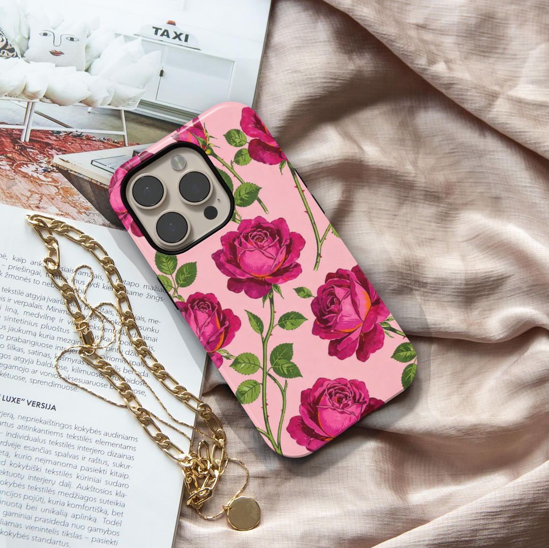 Pink rose floral iPhone 17 Pro Max case with bold red roses on blush background, aesthetic MagSafe tough case for women.