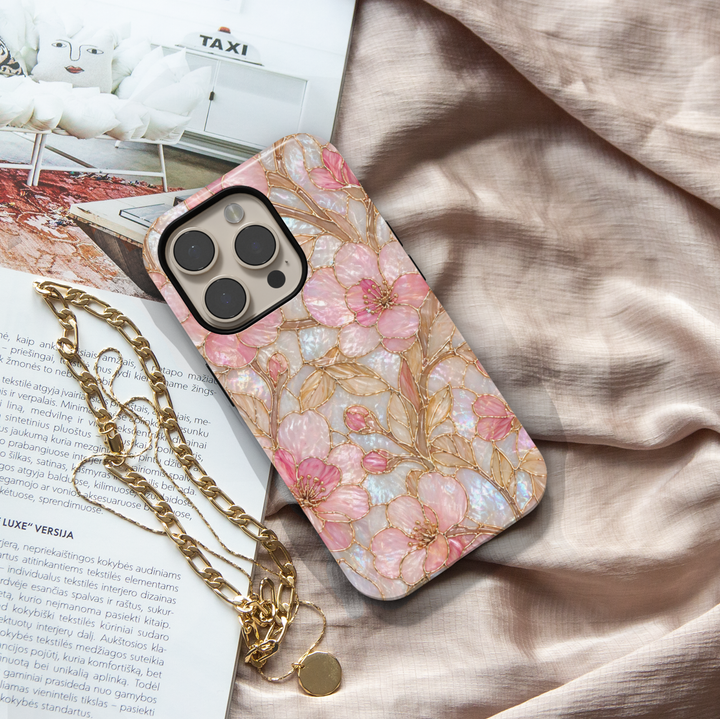 Pink floral iPhone 17 Pro Max case with pearl iridescent background and gold detailing, aesthetic MagSafe tough case.