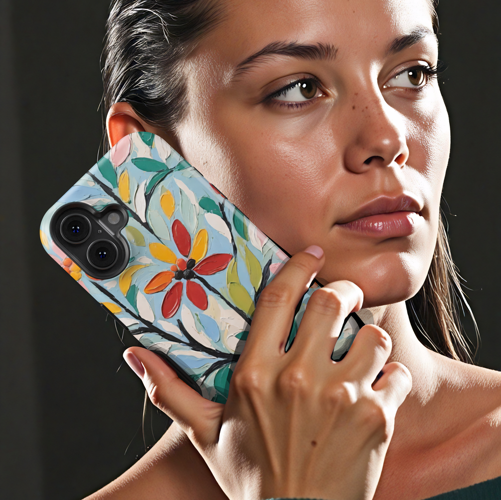 Painterly floral iPhone case featuring textured oil painting flowers in red, yellow, green, and blue with expressive brushstrokes.