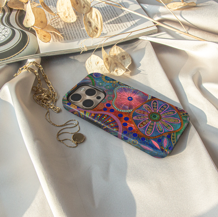 Colorful boho floral iPhone case featuring abstract flowers, vibrant geometric patterns, and artistic botanical design.
