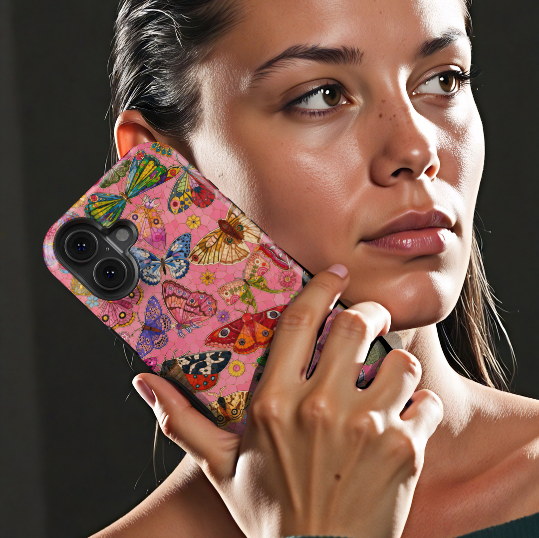 Pink butterfly iPhone case featuring colorful butterflies, moths, flowers, and whimsical nature-inspired artwork.